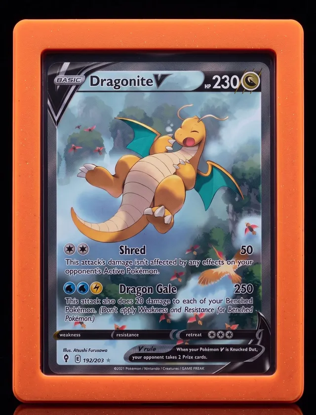 Alpha Loader in Ember holding Dragonite V